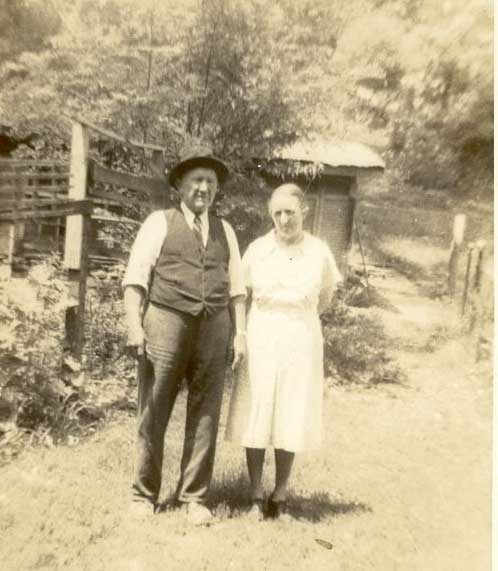 2. Gustave "Gus" A. Worz with his daughter Eva Helen WorzAchor, mother of Robert L Achor. Picture taken about 1930 on the lowerlevel along the river. You can see both sides of the river at the right ofthe picture beyond the small building. 